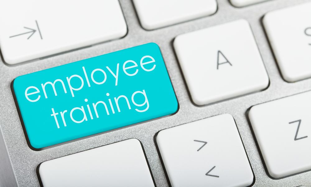 A button on a keyboard that reads "employee training" as an option.