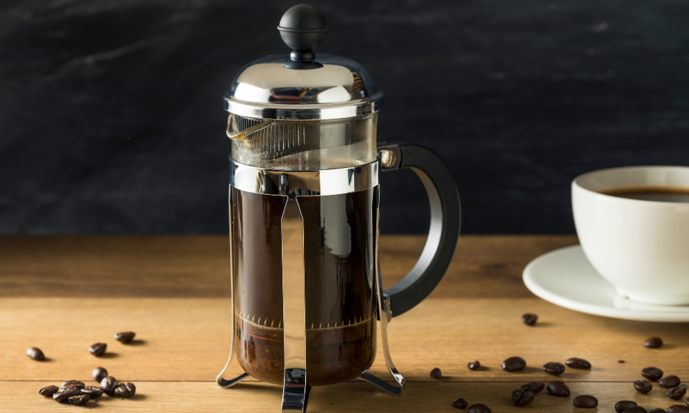 10 Ways To Brew Coffee In Your Restaurant 3 French press full of hot coffee.