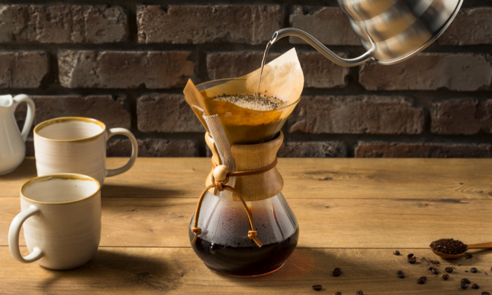 10 Ways To Brew Coffee In Your Restaurant 1 Hot water poured into a pour-over coffee filter.