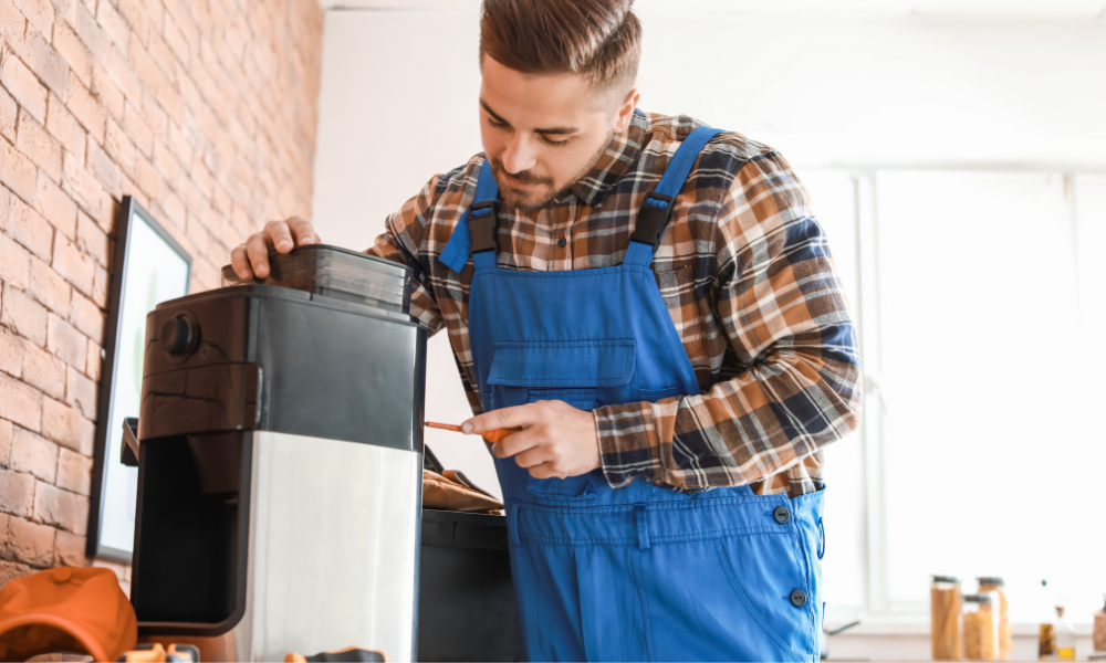 Technician opening a coffee machine.
